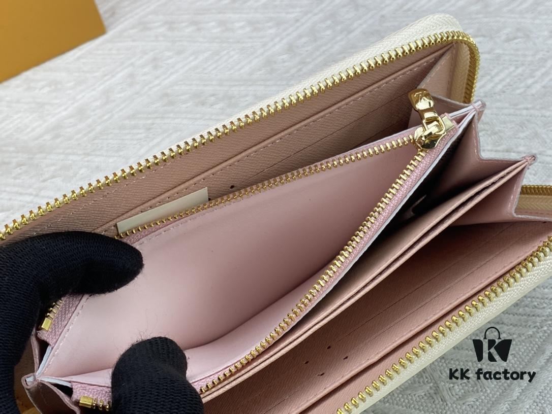 693070f26e68136f4d9a5a29 Wallet M82839 White Check This collectible multi-compartment zip wallet is crafted from Monogram canvas from the Vivienne Holidays 2022 collection, featuring a delicate print of Vivienne, Louis Vuitton's mascot, standing in front of the brand's avant-garde Tokyo boutique with Japan's iconic Mount Fuji in the background. This vibrant high-end wallet feels like an invitation to travel and makes a perfect gift.