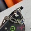 693071406e68136f4d9a5ac2 M13404 M13663 Black Color White Color This Pochette Accessoires handbag is crafted from coated canvas featuring a vibrant Monogram pattern, showcasing the dynamic collaboration between Louis Vuitton and Takashi Murakami. Trimmed with cowhide leather and accented with striking metal hardware, it highlights meticulous craftsmanship. The detachable shoulder strap and chain allow for versatile carrying options. Dimensions: 22x13x4cm