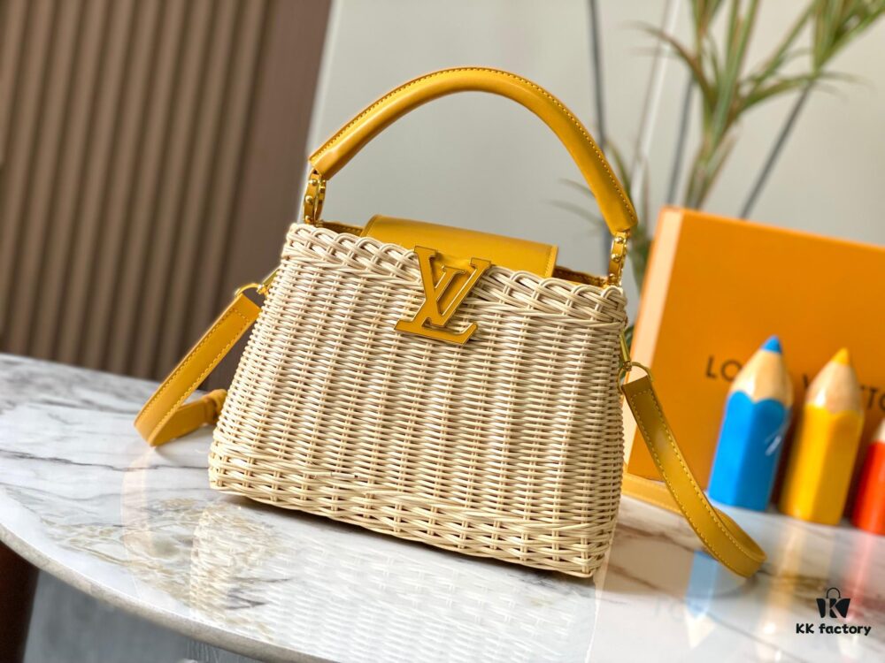 6930736f6e68136f4d9a5f15 Upgraded M11617 Capucines BB Handbag featuring a woven rattan design inspired by the 1892 Louis Vuitton picnic trunk, crafted with cowhide leather handles and flap, metallic LV logo, detachable and adjustable leather shoulder strap for crossbody wear. Packaging may vary based on availability.