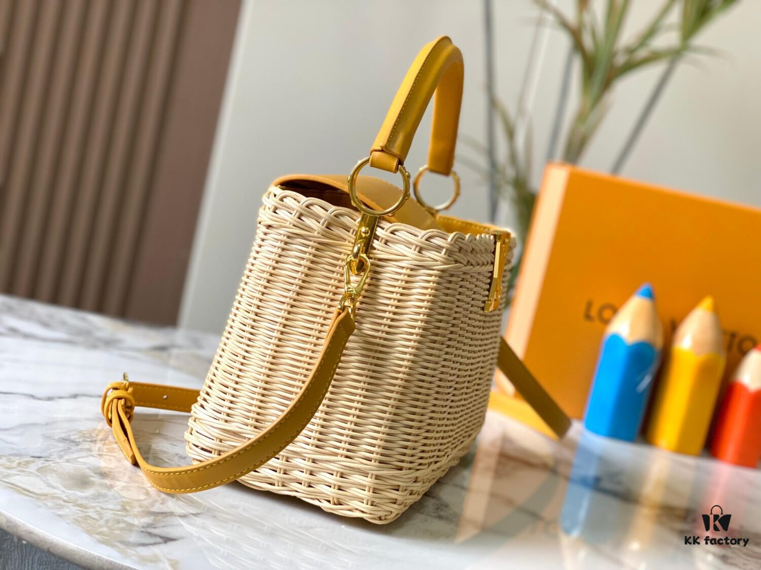 Upgraded M11617 Capucines BB Handbag featuring a woven rattan design inspired by the 1892 Louis Vuitton picnic trunk, crafted with cowhide leather handles and flap, metallic LV logo, detachable and adjustable leather shoulder strap for crossbody wear. Packaging may vary based on availability.
