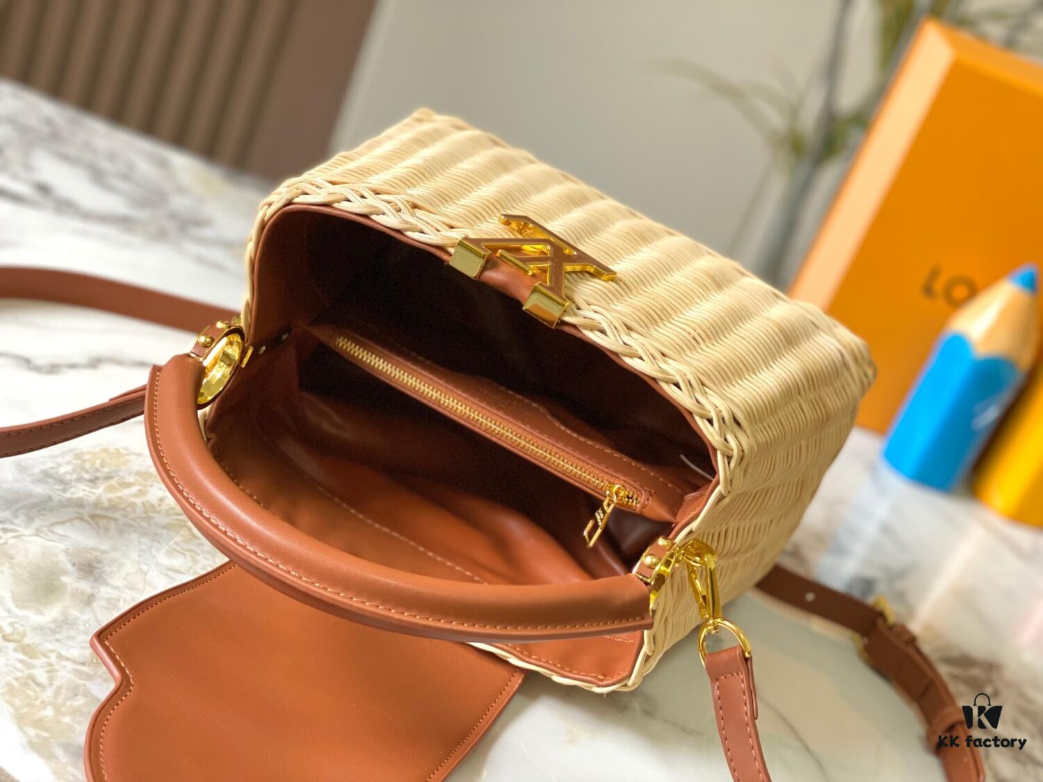 693073786e68136f4d9a5f26 Upgraded M11617 Capucines BB Handbag featuring a woven rattan design inspired by the 1892 Louis Vuitton picnic trunk