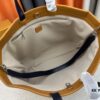 693073c06e68136f4d9a5fb4 M24457 This Shopper Medium Bag Draws Inspiration from Louis Vuitton's Shopping Tote