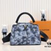 693074496e68136f4d9a60d8 Upgraded Black M21726 Louis Vuitton x Yayoi Kusama Capsule Collection Reimagines the LV x YK Capucines Medium Handbag in a Surreal Dreamscape, Drawing Inspiration from the Japanese Artist's 'My Eternal Soul' Series Since 2009, Featuring Eccentric Faces and Organic Forms. The Artistic Design Is Enhanced with Printed and Embroidered Motifs on Luxurious Taurillon Leather, Making It a Distinguished Addition to Any Art-Inspired Collection.