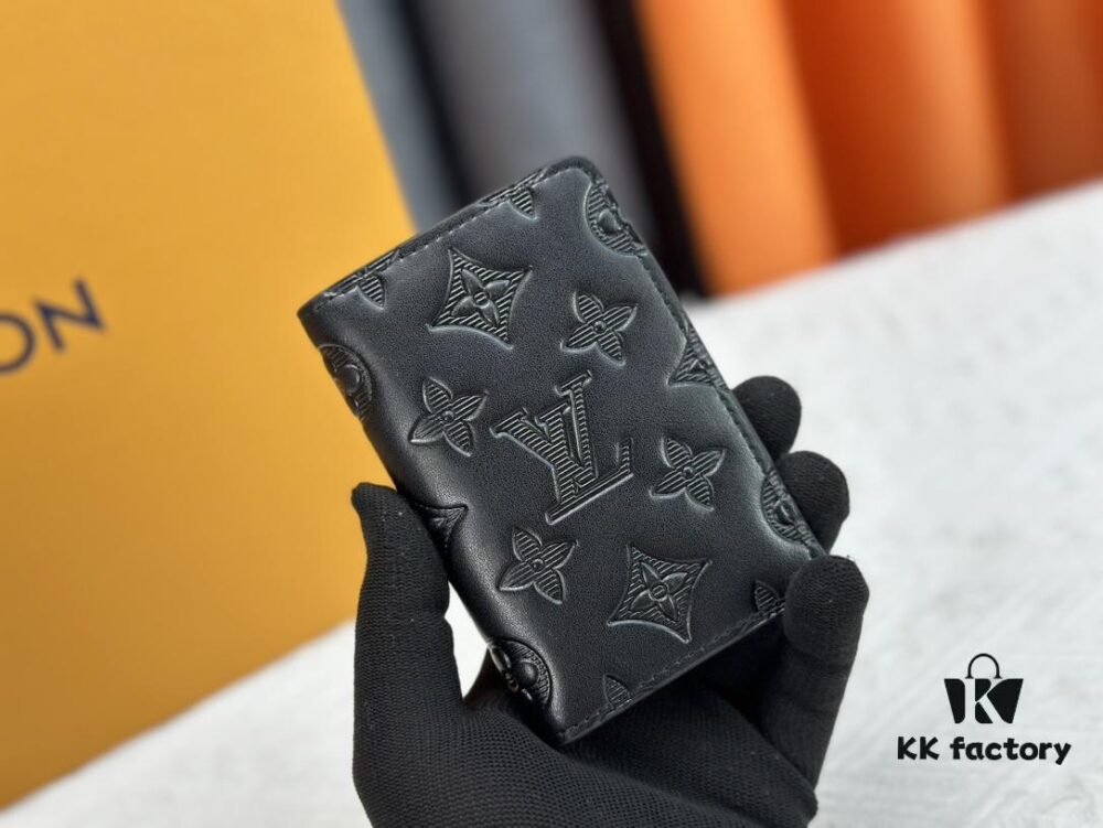 M62899 Wallet: This compact wallet reinterprets the classic design with Monogram Shadow leather. Soft cowhide is embossed with Louis Vuitton's iconic Monogram pattern, while interior compartments and card slots provide organized storage for everyday essentials.