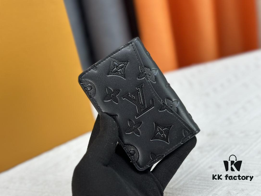 M62899 Wallet: This compact wallet reinterprets the classic design with Monogram Shadow leather. Soft cowhide is embossed with Louis Vuitton's iconic Monogram pattern, while interior compartments and card slots provide organized storage for everyday essentials.