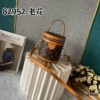 Upgraded Version [Exclusive Real Photo M82952 Damier Azur and Sunflower] This Nano Cannes Handbag features a cylindrical silhouette crafted from Monogram canvas, echoing the design of a makeup pouch.