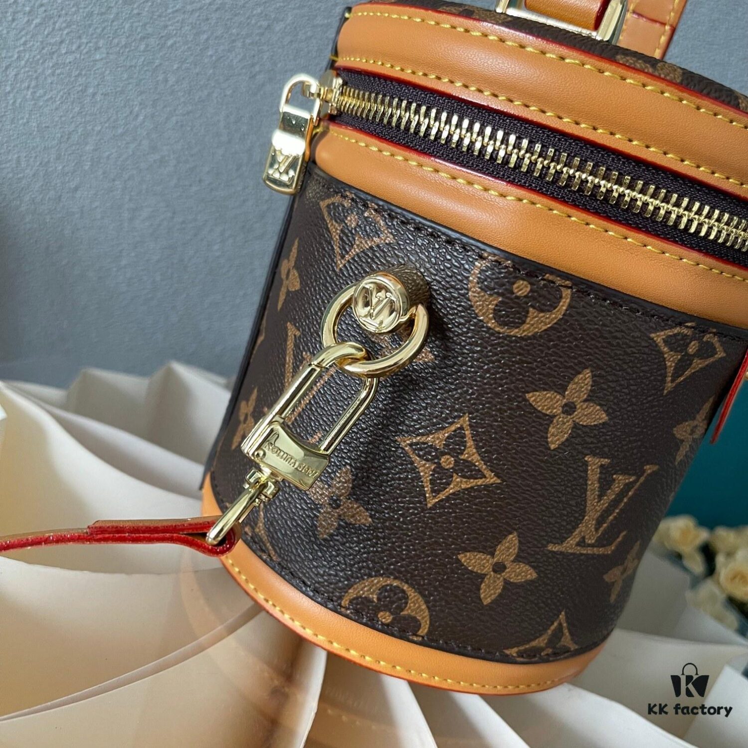 Upgraded Version [Exclusive Real Photo M82952 Damier Azur and Sunflower] This Nano Cannes Handbag features a cylindrical silhouette crafted from Monogram canvas, echoing the design of a makeup pouch.
