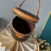 Upgraded Version [Exclusive Real Photo M82952 Damier Azur and Sunflower] This Nano Cannes Handbag features a cylindrical silhouette crafted from Monogram canvas, echoing the design of a makeup pouch.