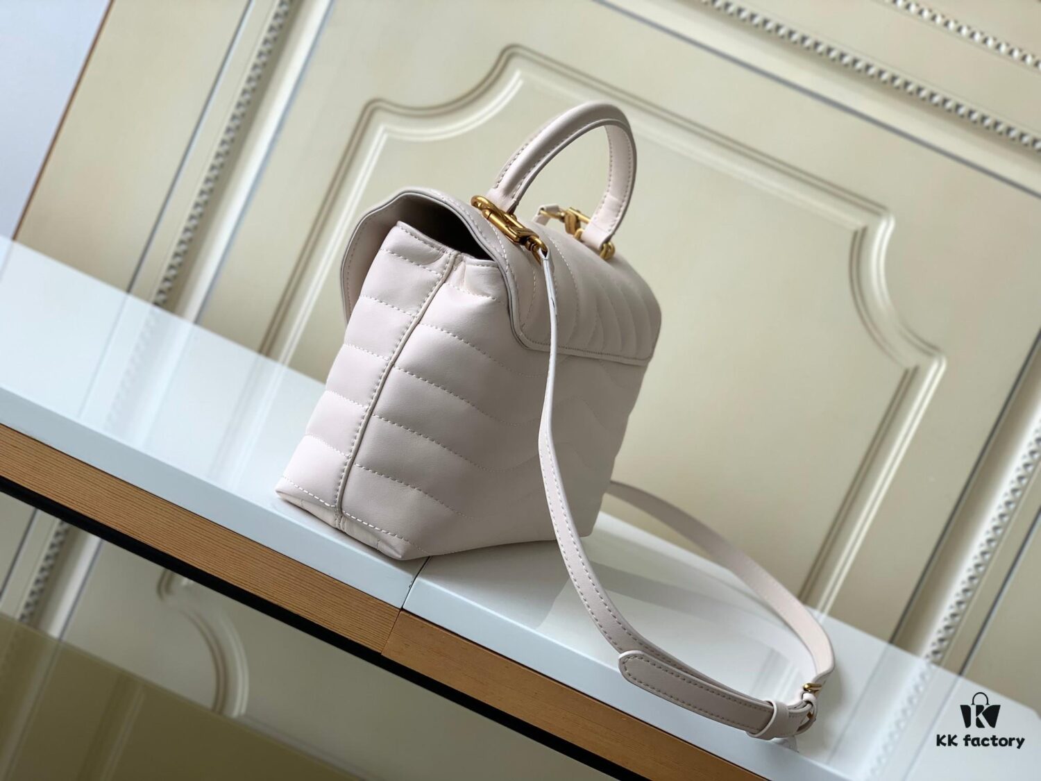 693077bd6e68136f4d9a67ec Louis Vuitton Hold Me Handbag in Black M21720 and White M21797 – New Wave Quilted Leather Collection