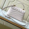 693077bd6e68136f4d9a67ed Louis Vuitton Hold Me Handbag in Black M21720 and White M21797 – New Wave Quilted Leather Collection