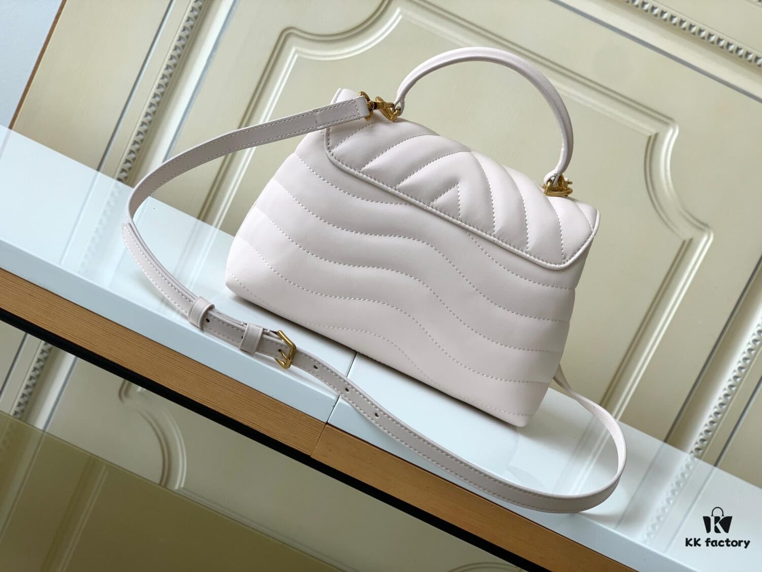 693077bd6e68136f4d9a67ed Louis Vuitton Hold Me Handbag in Black M21720 and White M21797 – New Wave Quilted Leather Collection