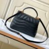 693077c36e68136f4d9a67f5 Louis Vuitton Hold Me Handbag in Black M21720 and White M21797 – New Wave Quilted Leather Collection