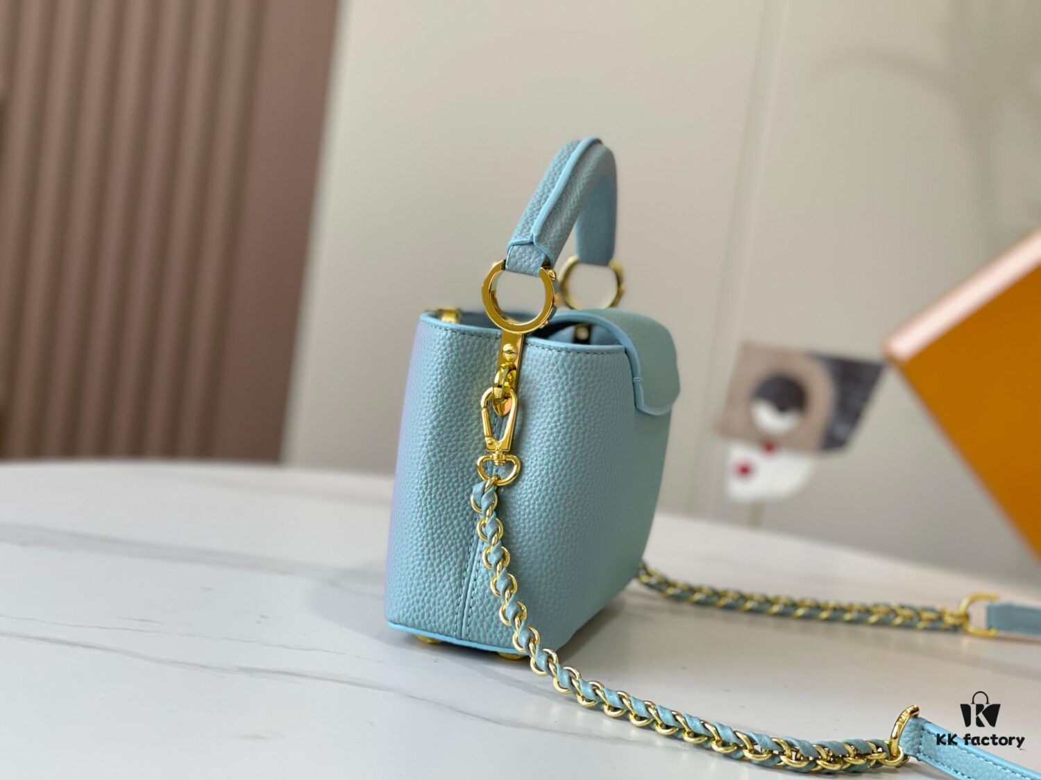 693079896e68136f4d9a6b64 Upgraded M59850 Stellar Pearlized Blue Shell Button Capucines Mini Bag