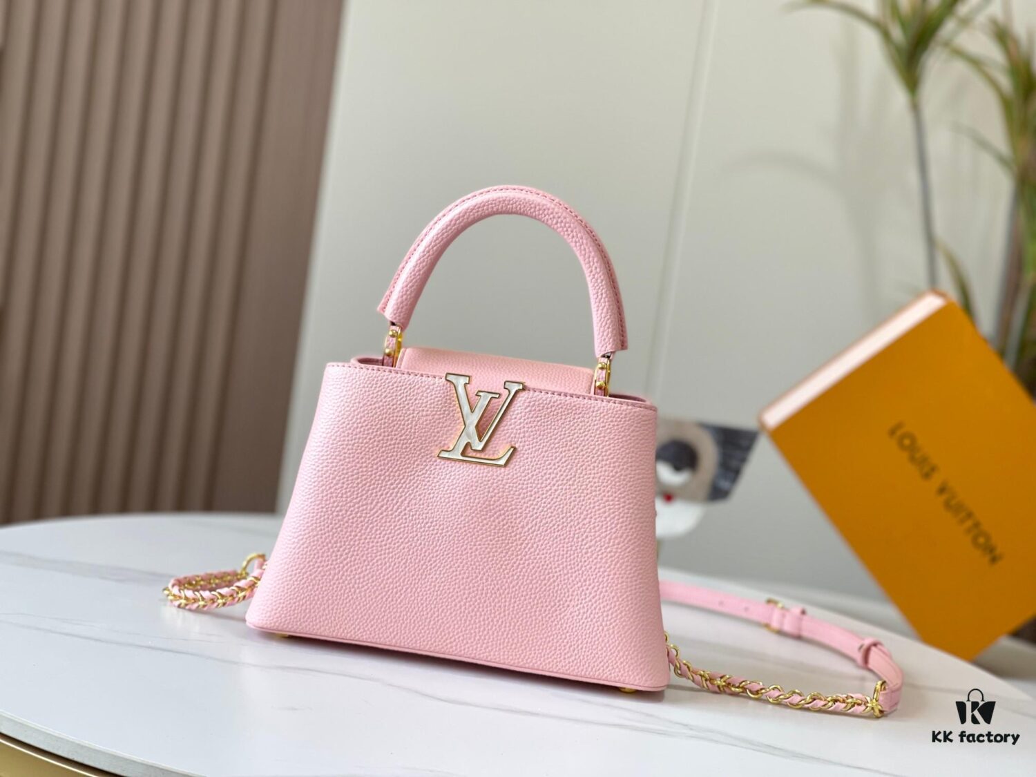 693079946e68136f4d9a6b75 Upgraded M59868 Stellar Pearlized Powder with Mother-of-Pearl Button - This Capucines BB Bag Features Taurillon Leather That Shimmers in Changing Hues Under Different Lights