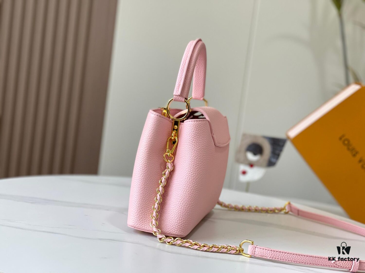 693079956e68136f4d9a6b78 Upgraded M59868 Stellar Pearlized Powder with Mother-of-Pearl Button - This Capucines BB Bag Features Taurillon Leather That Shimmers in Changing Hues Under Different Lights