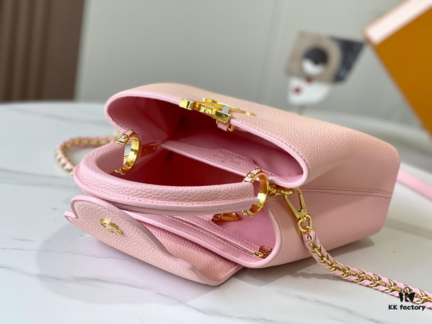 693079996e68136f4d9a6b7e Upgraded M59868 Stellar Pearlized Powder with Mother-of-Pearl Button - This Capucines BB Bag Features Taurillon Leather That Shimmers in Changing Hues Under Different Lights