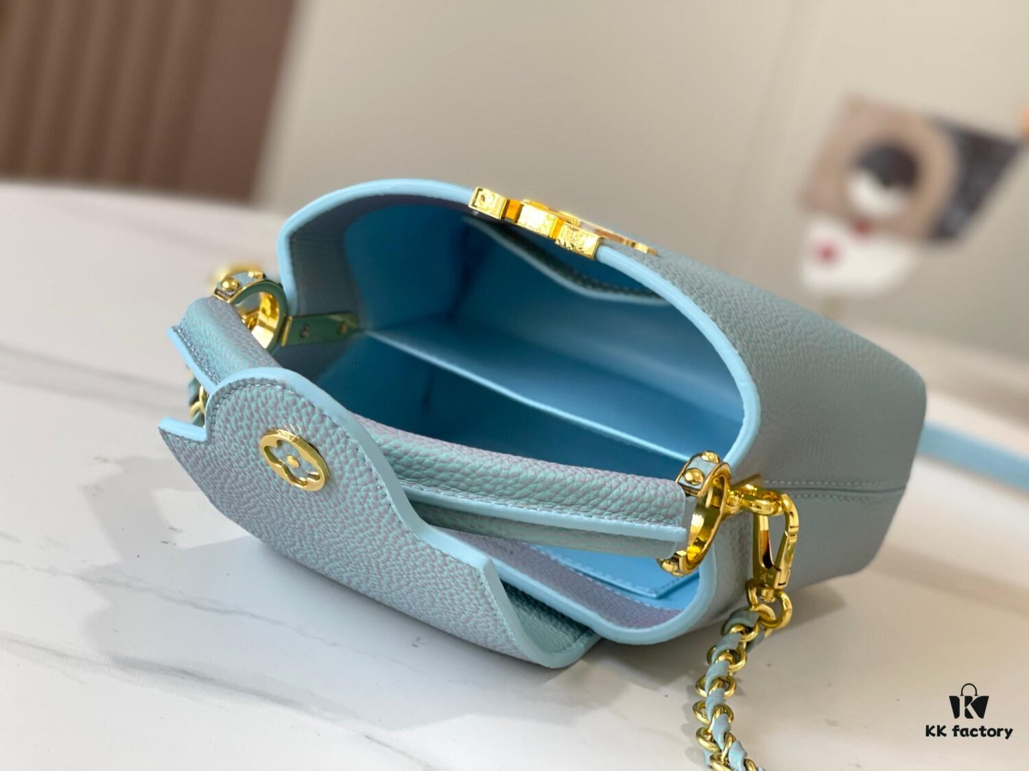 693079ad6e68136f4d9a6ba1 Upgraded M59850 Stellar Pearl Blue Shell Button Capucines Mini Bag