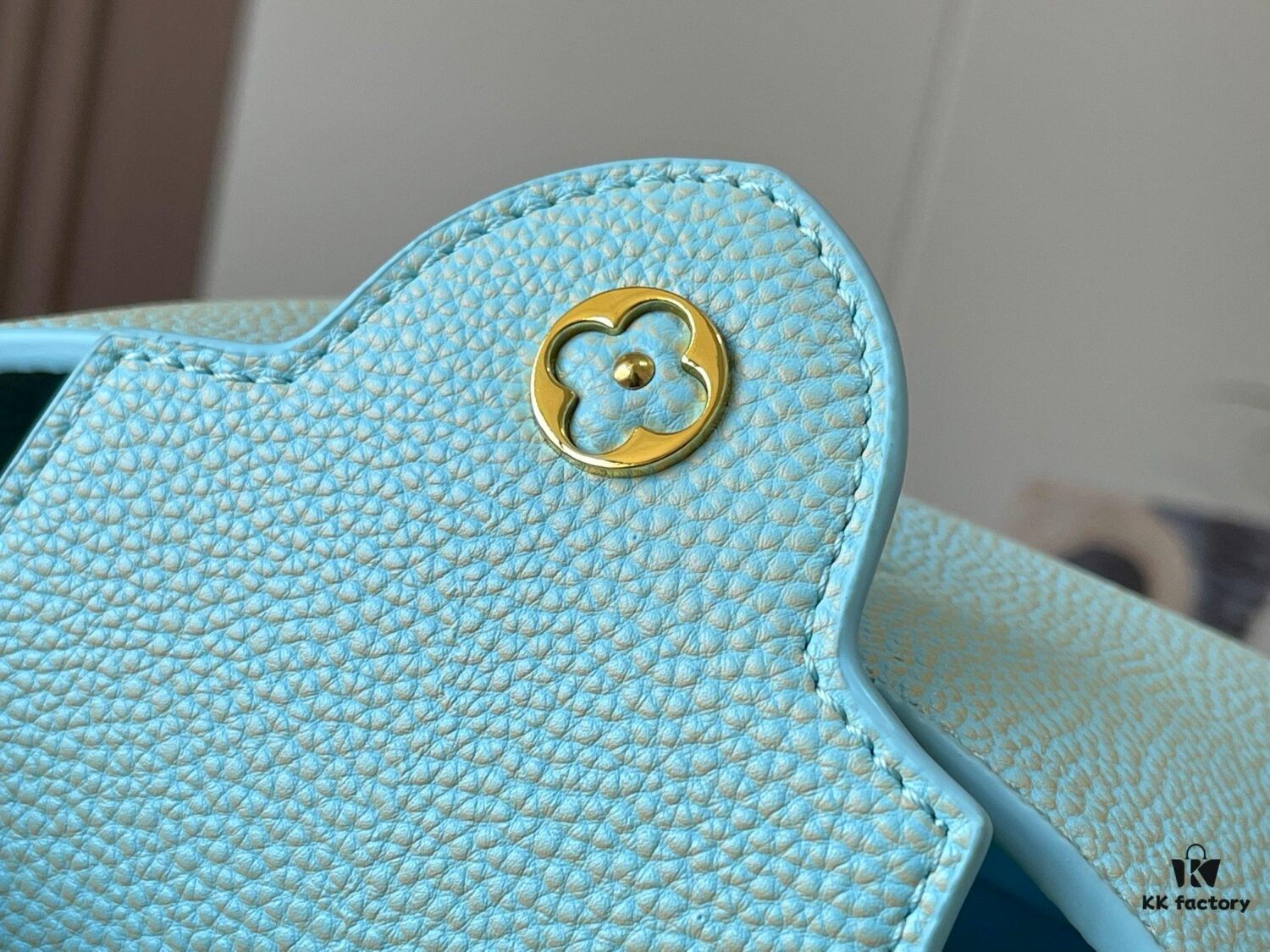 693079ae6e68136f4d9a6ba2 Upgraded M59850 Stellar Pearl Blue Shell Button Capucines Mini Bag