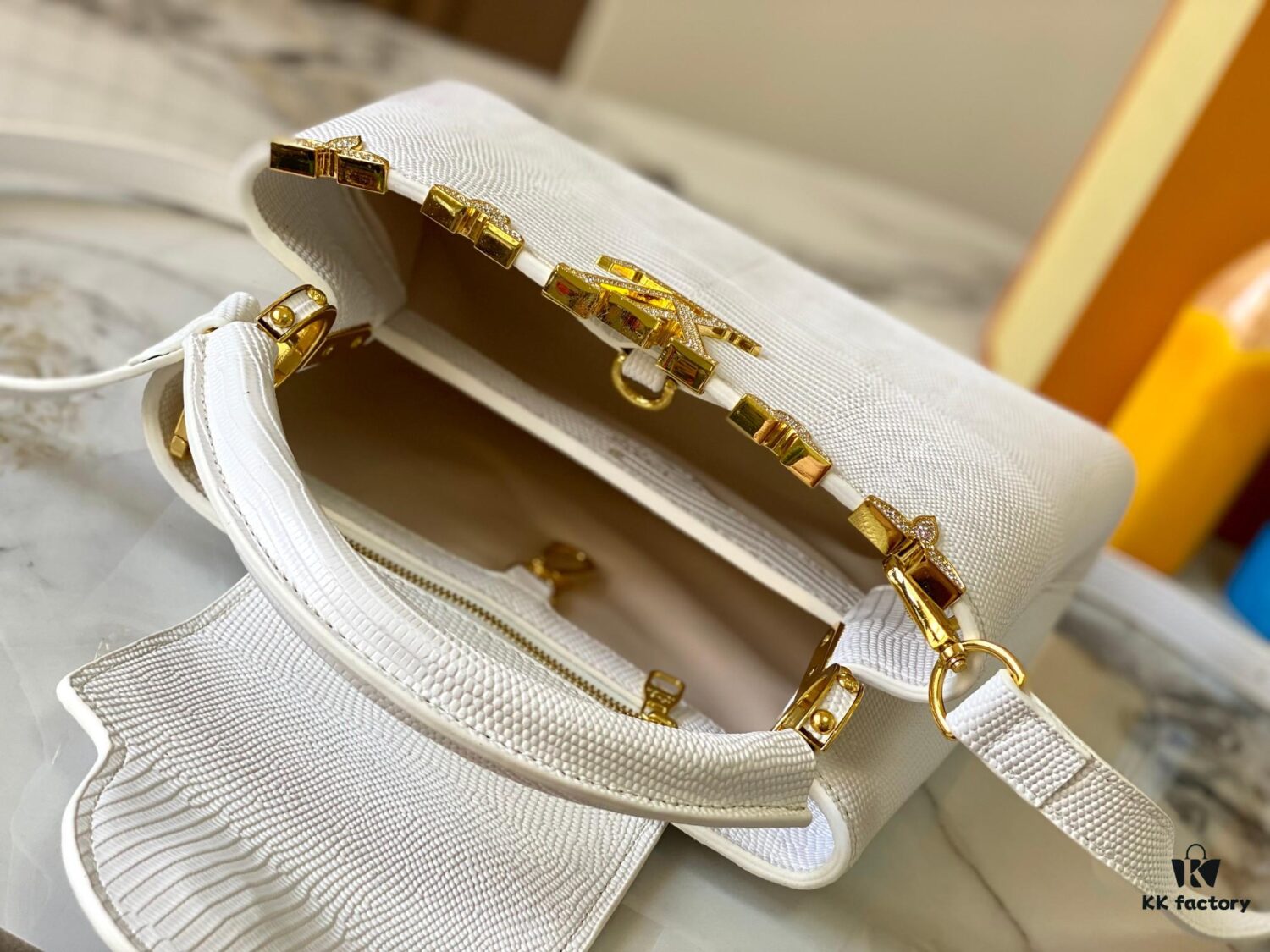 69307d8a6e68136f4d9a723e Top Quality Guangzhou Original M12297 White Lizard Skin with Gold Diamond Crown Triangle Capucines BB Bag