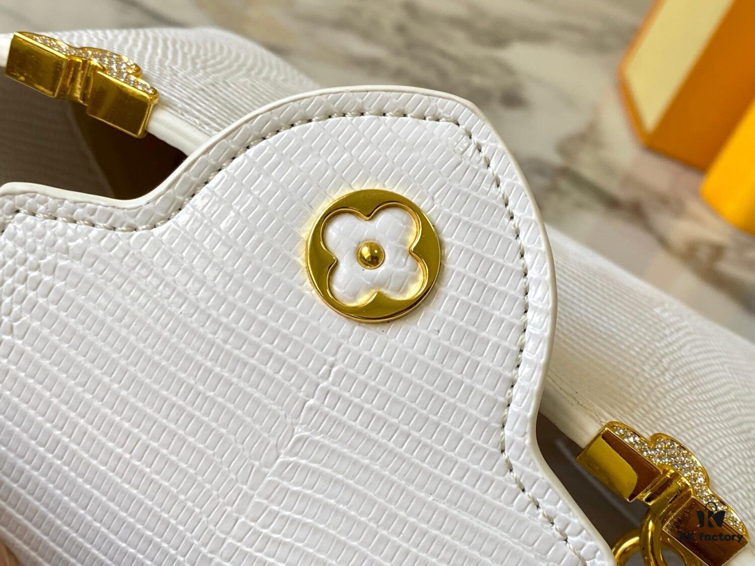 69307d916e68136f4d9a724e Top Quality Original Guangzhou M12296 White Lizard Skin with Gold Diamond Crown Capucines Mini Bag