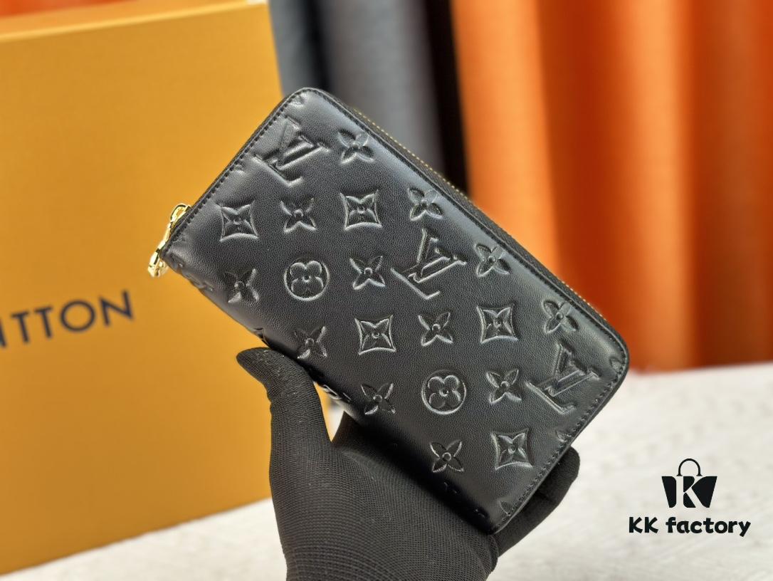 69307d9d6e68136f4d9a726a Wallet M81510 crafted in lambskin with padded Monogram embossed pattern, complementing the Coussin leather goods collection. The elegant design features a gold-tone zipper with an LV Circle pull tab. This multi-functional wallet includes practical interior features: three large compartments, a coin pocket, and twelve card slots.