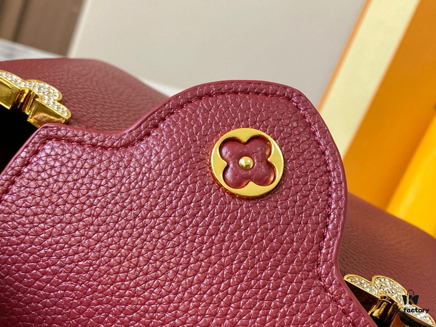 69307f1b6e68136f4d9a74fd Top Quality Original Guangzhou M24583 Date Red and Gold Diamond Flower Crown Capucines Handbag