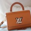 69307fa06e68136f4d9a7640 Top Quality Original Design! Welcome to Compare Prices! Model No.: 50392/22229/22236. This LV Twist Medium Bag is crafted from Epi grained leather, accented with woven leather wrapping the iconic LV Twist lock and top handle, adding a touch of elegance to its bold silhouette. The detachable and adjustable shoulder strap allows versatile carrying options—wear it short on the shoulder, long across the body, or crossbody.