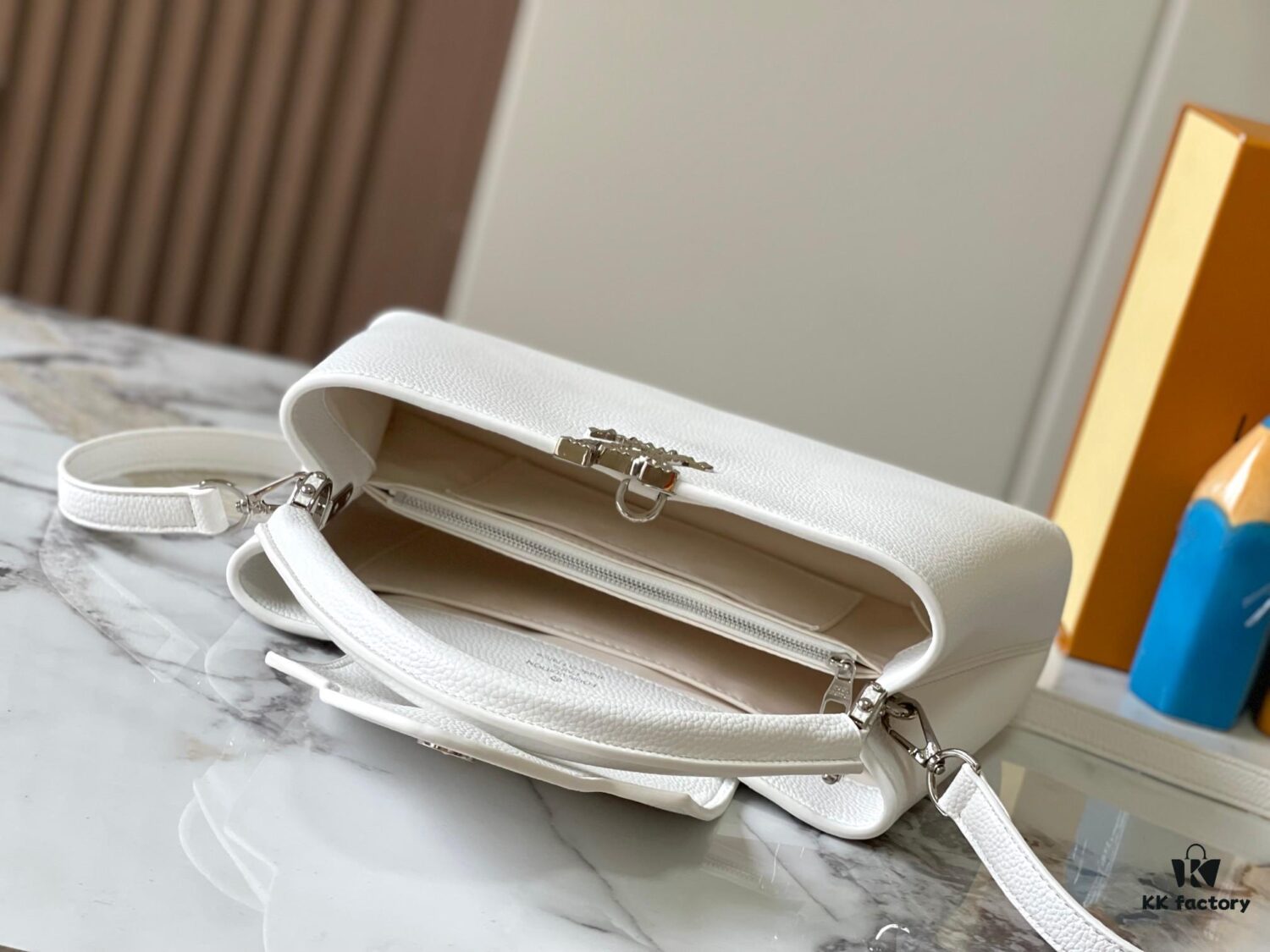 693082a36e68136f4d9a7cbf Upgraded M24664 Capucines East West Medium Handbag from the LV Crush Collection