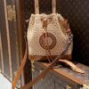 693083386e68136f4d9a7dd4 New Large Batch LV NOE PURSE Bucket Handbag with Raffia and Leather Trim