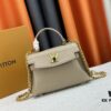6930835f6e68136f4d9a7e14 Exclusive Background Upgraded Original Version M21088 M21052 M20997 This Season, the Petite Lockme Ever Mini Bag Features Fashionable New Hues in Grained Calfskin Leather