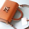 693083aa6e68136f4d9a7e9a Top Original Quality! Welcome to Compare Prices! Model No.: 50392/22229/22236. This LV Twist Medium Bag is crafted from Epi grained leather, featuring woven leather wrapping around the LV Twist lock and top handle, adding a soft elegance to its striking silhouette. The detachable and adjustable shoulder strap allows for versatile carrying options—short shoulder, long shoulder, or crossbody wear.