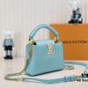 6930862b6e68136f4d9a8470 Upgraded M59850 Stellar Pearlized Blue Shell Button Capucines Mini Bag
