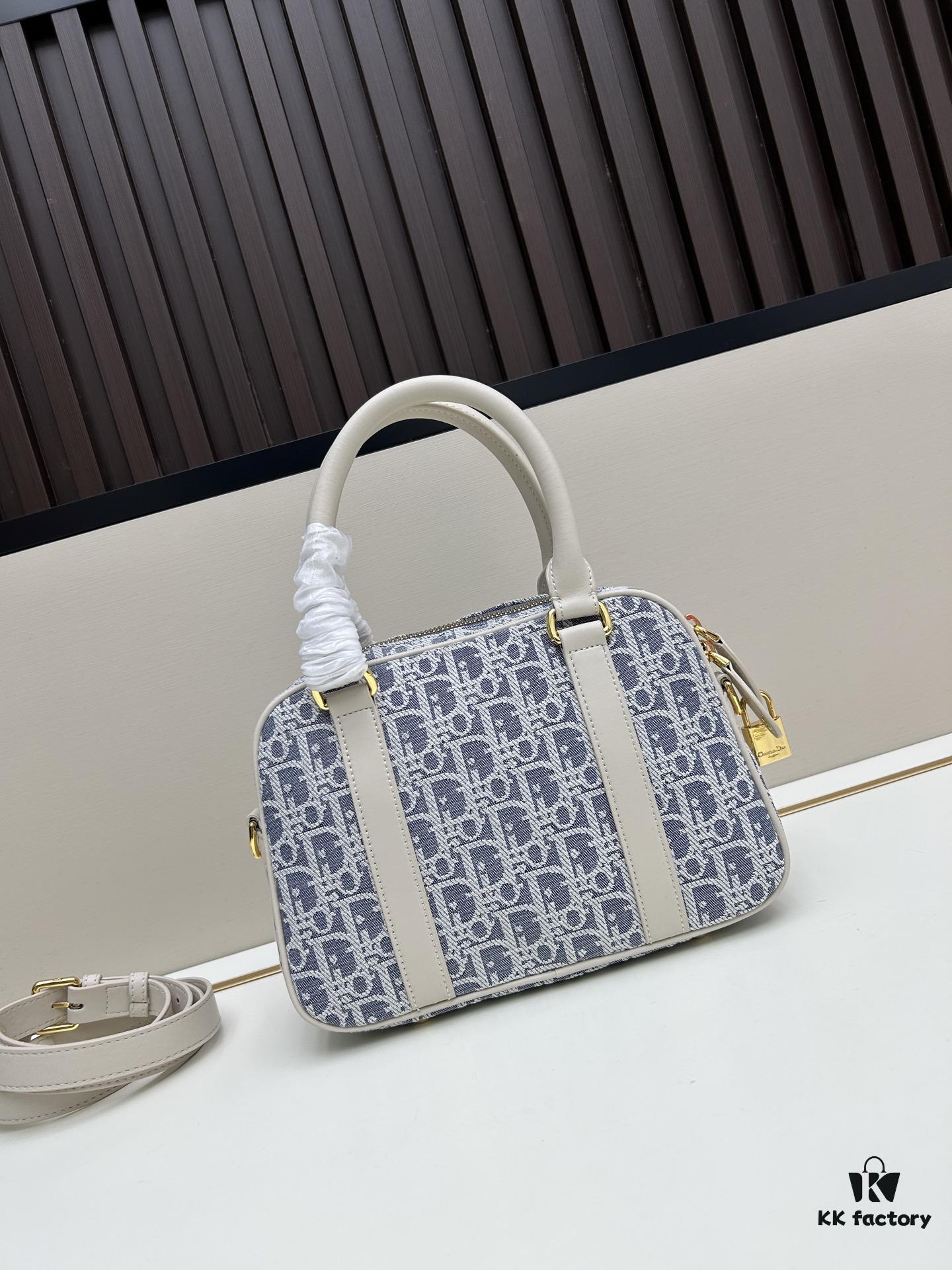 693094486e68136f4d9aa004 Small D-Vibe Bowling Bag in Blue Oblique Print