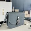 Box Included [Top Original Version] This mini saddle messenger bag is exquisitely stylish, crafted from black grained calf leather and adorned with a flap closure and 'DIOR' signature, highlighting the refined charm of the saddle design. Spacious interior compartments with a patch pocket accommodate daily essentials. Equipped with an adjustable leather shoulder strap for versatile wear as a shoulder or crossbody bag.