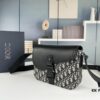 Box Included [Top Original Version] This mini saddle messenger bag is exquisitely fashionable, crafted from black grained cowhide leather and adorned with a flap closure and 'DIOR' signature, highlighting the refined charm of the saddle design. Spacious interior compartments with a patch pocket allow for organizing daily essentials. Equipped with an adjustable leather shoulder strap, it can be worn over the shoulder or crossbody.