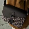 Box Included [Top Original Version] This mini saddle messenger bag is exquisitely crafted and stylish, made from black grained calf leather with a flap closure and 'DIOR' signature, highlighting the refined charm of the saddle design. Spacious interior compartments with a patch pocket for organizing daily essentials. Adjustable leather shoulder strap allows for shoulder or crossbody wear.