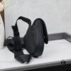 693095a36e68136f4d9aa2a0 This boxed saddle bag is a new piece from the classic collection, crafted in black grained calfskin leather.