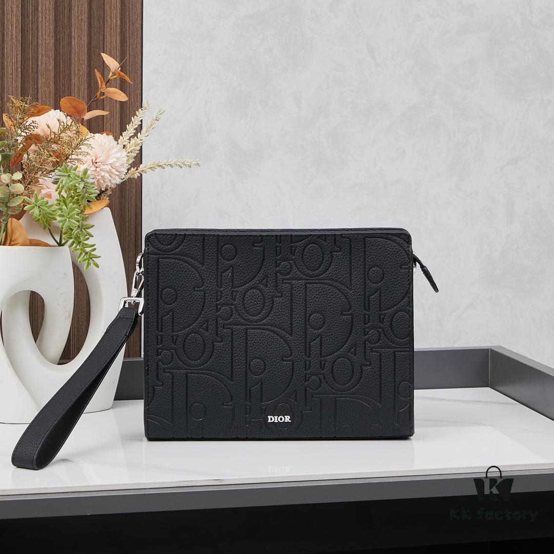 693095a86e68136f4d9aa2a7 Dior Envelope Clutch with Box ||| Crafted from premium calf leather, this Dior envelope clutch draws inspiration from the brand's archives, featuring a signature Dior logo plaque on the front for elevated sophistication. Spacious zip compartment fits most smartphones, complemented by six card slots. Includes a detachable grained calfskin wrist strap with lobster clasp for versatile carrying options—either handheld or tucked into a larger handbag.