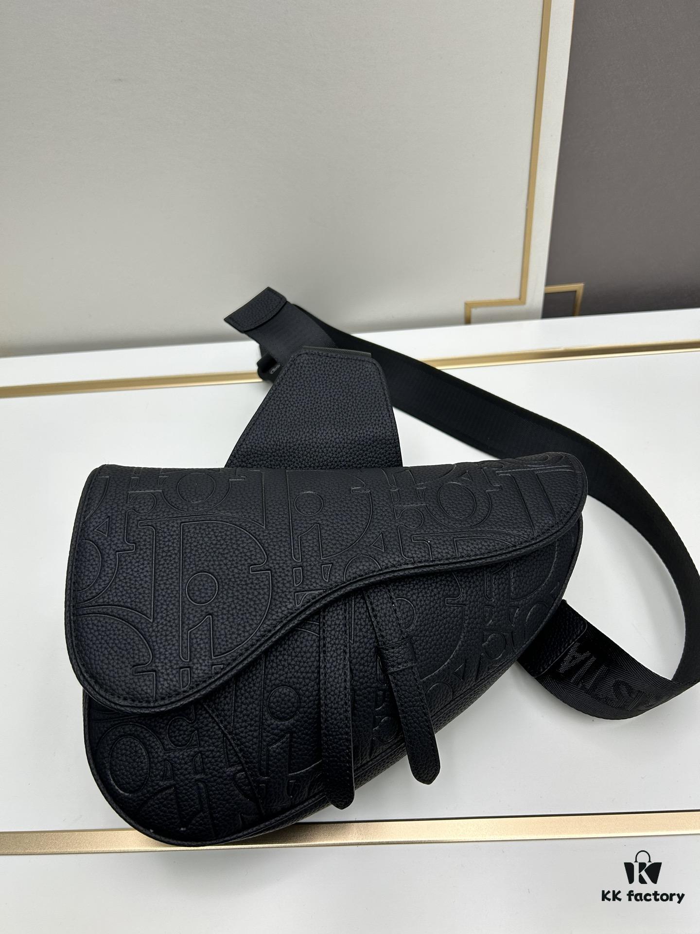 693097266e68136f4d9aa5e9 This boxed saddle bag is a new piece from the classic collection, meticulously crafted from black grained leather. A magnetic flap conceals a zip pocket for daily essentials, and it features an adjustable Christian Dior jacquard webbing strap for shoulder or crossbody wear.