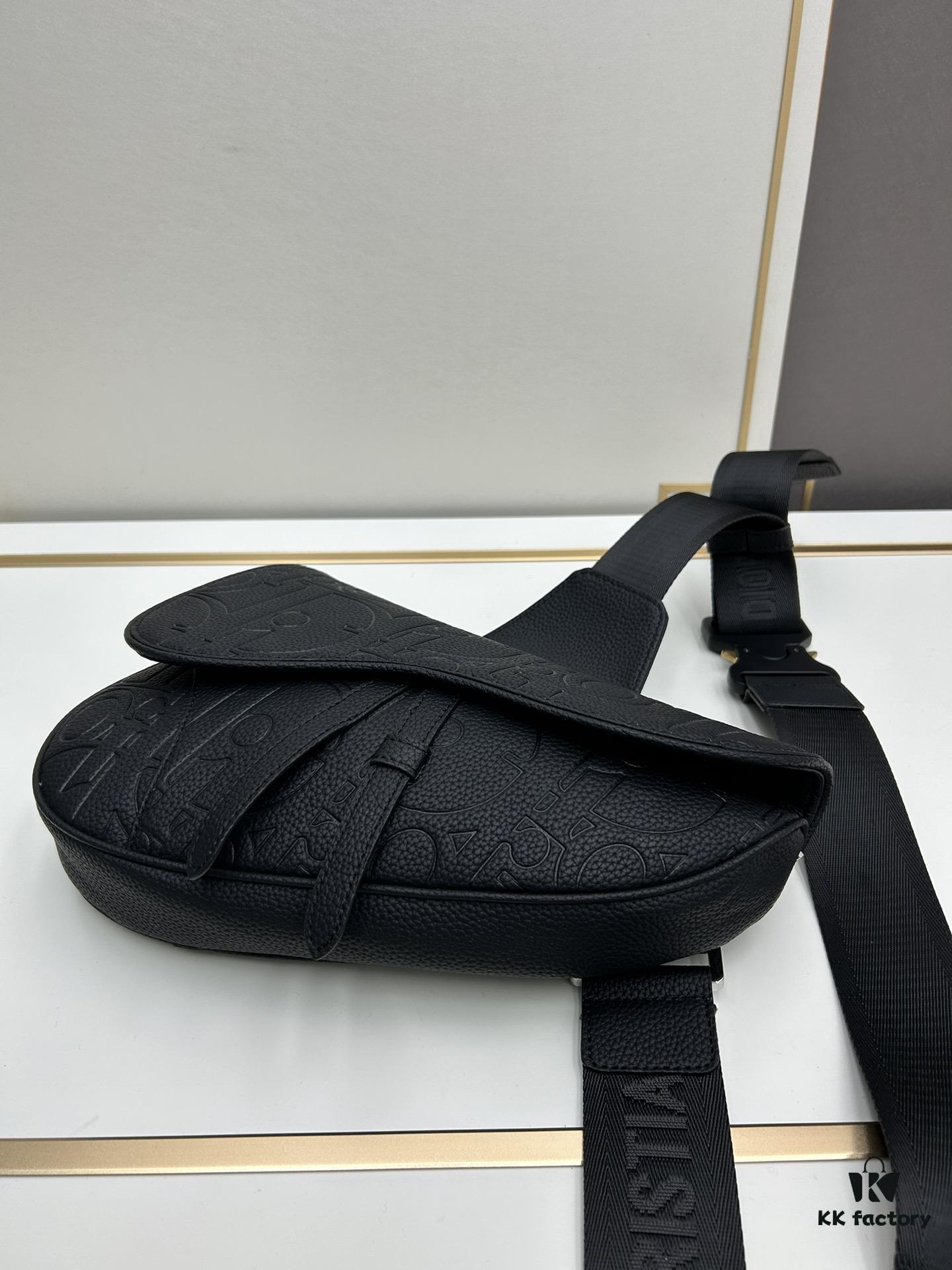 693097276e68136f4d9aa5eb This boxed saddle bag is a new piece from the classic collection, meticulously crafted from black grained leather. A magnetic flap conceals a zip pocket for daily essentials, and it features an adjustable Christian Dior jacquard webbing strap for shoulder or crossbody wear.