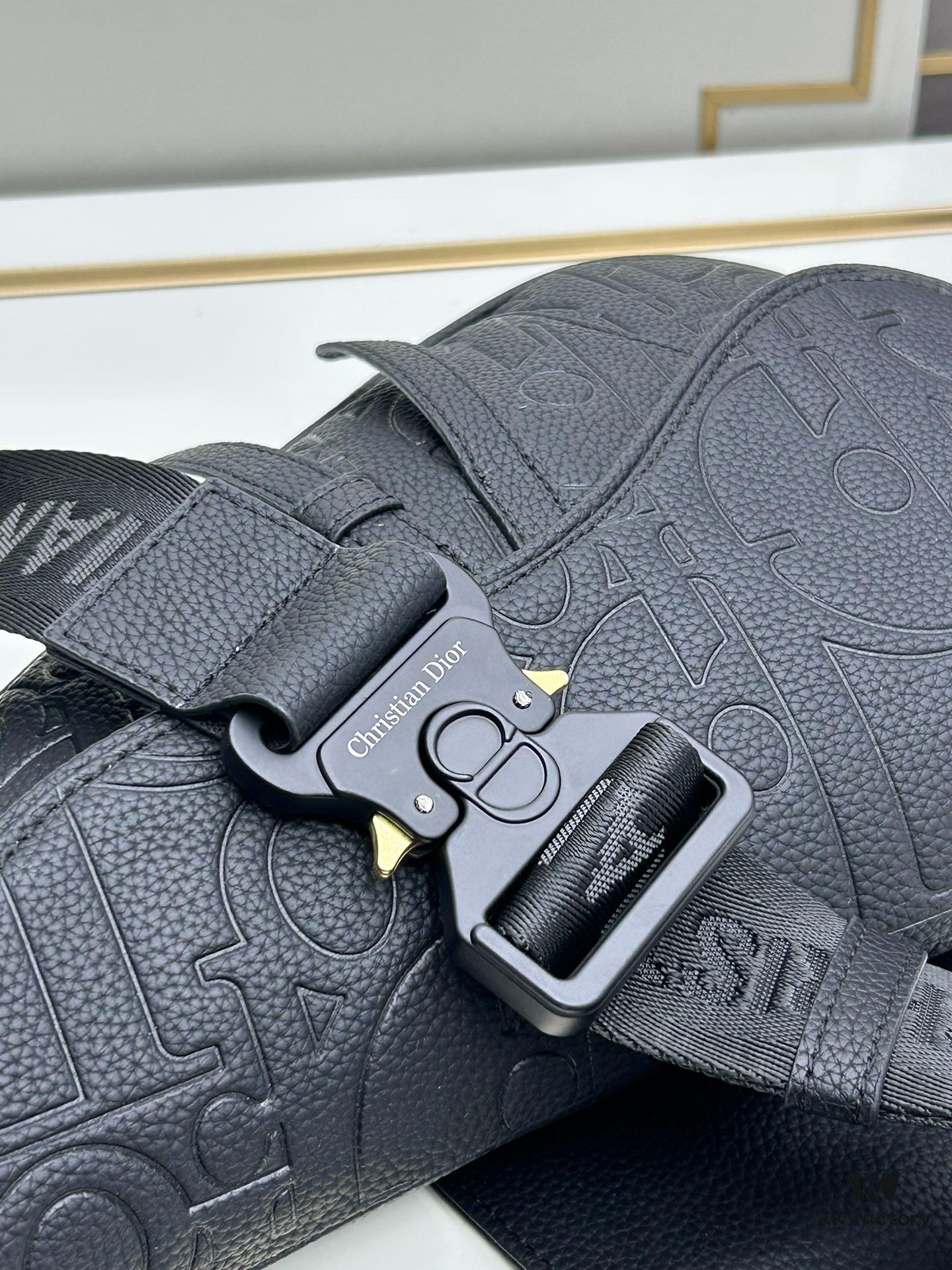 693097286e68136f4d9aa5ec This boxed saddle bag is a new piece from the classic collection, meticulously crafted from black grained leather. A magnetic flap conceals a zip pocket for daily essentials, and it features an adjustable Christian Dior jacquard webbing strap for shoulder or crossbody wear.