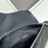 693097296e68136f4d9aa5ee This boxed saddle bag is a new piece from the classic collection, meticulously crafted from black grained leather. A magnetic flap conceals a zip pocket for daily essentials, and it features an adjustable Christian Dior jacquard webbing strap for shoulder or crossbody wear.