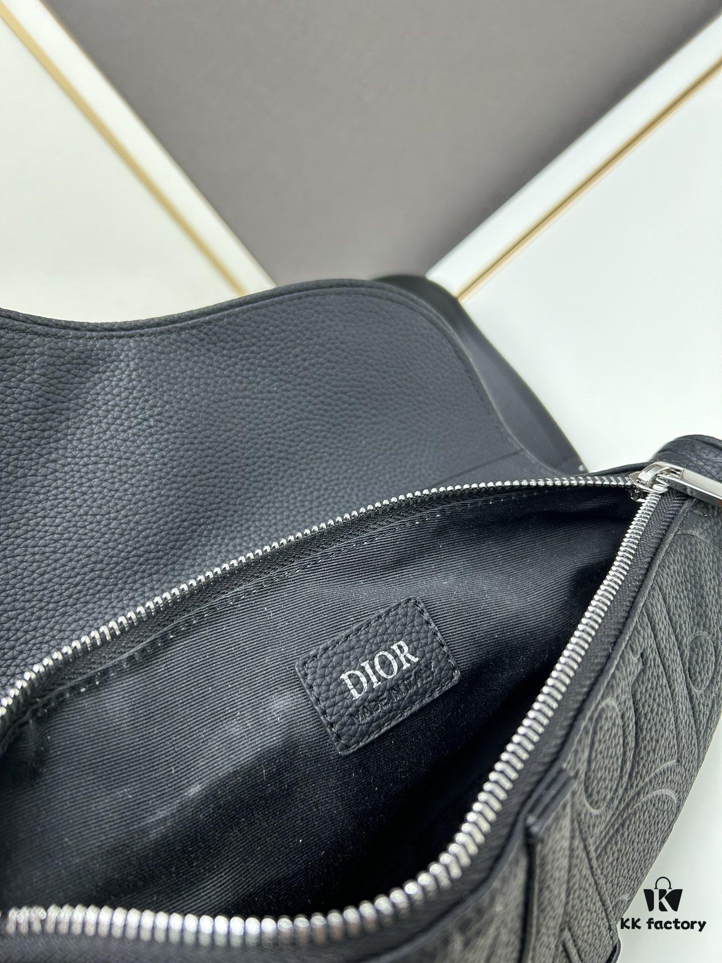 693097296e68136f4d9aa5ee This boxed saddle bag is a new piece from the classic collection, meticulously crafted from black grained leather. A magnetic flap conceals a zip pocket for daily essentials, and it features an adjustable Christian Dior jacquard webbing strap for shoulder or crossbody wear.