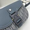 6930975b6e68136f4d9aa641 Dior Saddle Clutch with Shoulder Strap, Grainy Calfskin and Oblique Print, Black and Beige