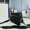 693099c06e68136f4d9aaaeb Safari Messenger Bag with Box This practical and compact messenger bag is ideal for daily use. Crafted from black Oblique printed fabric, it features details in black grained calf leather. Equipped with a zip compartment and a front pocket for everyday essentials, it comes with an adjustable Christian Dior shoulder strap for shoulder or crossbody wear.