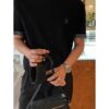 693099cf6e68136f4d9aab08 Safari Messenger Bag with Box This practical and compact messenger bag is ideal for everyday use. Crafted from black Oblique printed fabric, it features details in black grained calfskin leather. Equipped with a zippered compartment and a front pocket for daily essentials, it comes with an adjustable Christian Dior shoulder strap that allows for shoulder or crossbody wear.