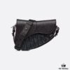 69309d056e68136f4d9ab147 This saddle bag reinterprets the classic design with a modern structure. Crafted from beige and black Oblique printed fabric, it features a signature black grained cowhide magnetic flap and a concealed zip closure. The interior includes a large compartment and slip pockets for daily essentials. The mini style comes with an adjustable, detachable leather shoulder strap, allowing for handheld, shoulder, or crossbody wear.