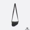 69309d066e68136f4d9ab149 This saddle bag reinterprets the classic design with a modern structure. Crafted from beige and black Oblique printed fabric, it features a signature black grained cowhide magnetic flap and a concealed zip closure. The interior includes a large compartment and slip pockets for daily essentials. The mini style comes with an adjustable, detachable leather shoulder strap, allowing for handheld, shoulder, or crossbody wear.