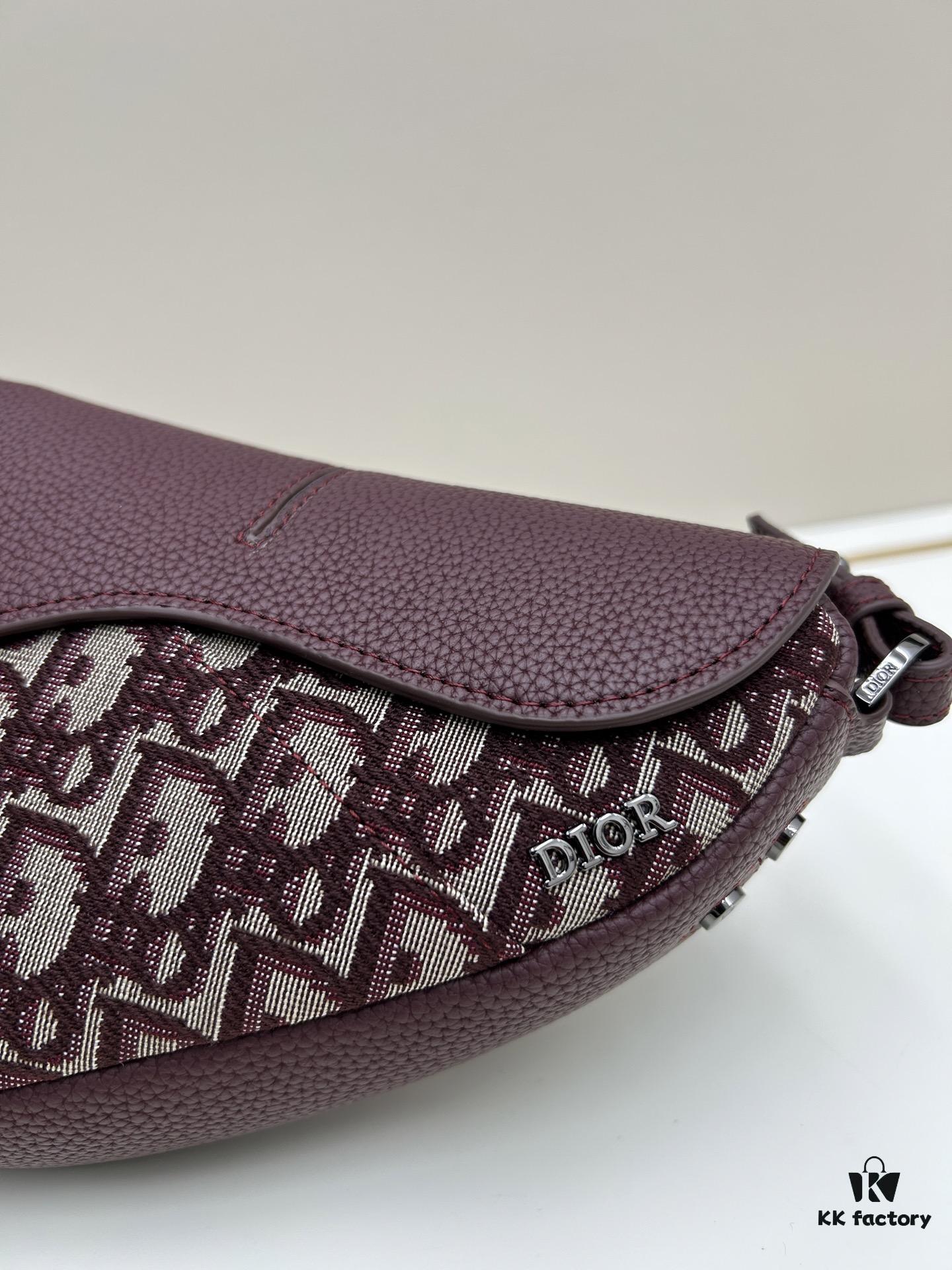 69309d126e68136f4d9ab15d This saddle bag reinterprets the classic design with a modern structure. Crafted from beige and black Oblique printed fabric, it features a signature grained black calfskin magnetic flap and hidden zip closure. The interior includes a spacious compartment and slip pocket for daily essentials. The mini style comes with an adjustable, detachable leather shoulder strap, allowing for handheld, shoulder, or crossbody wear.
