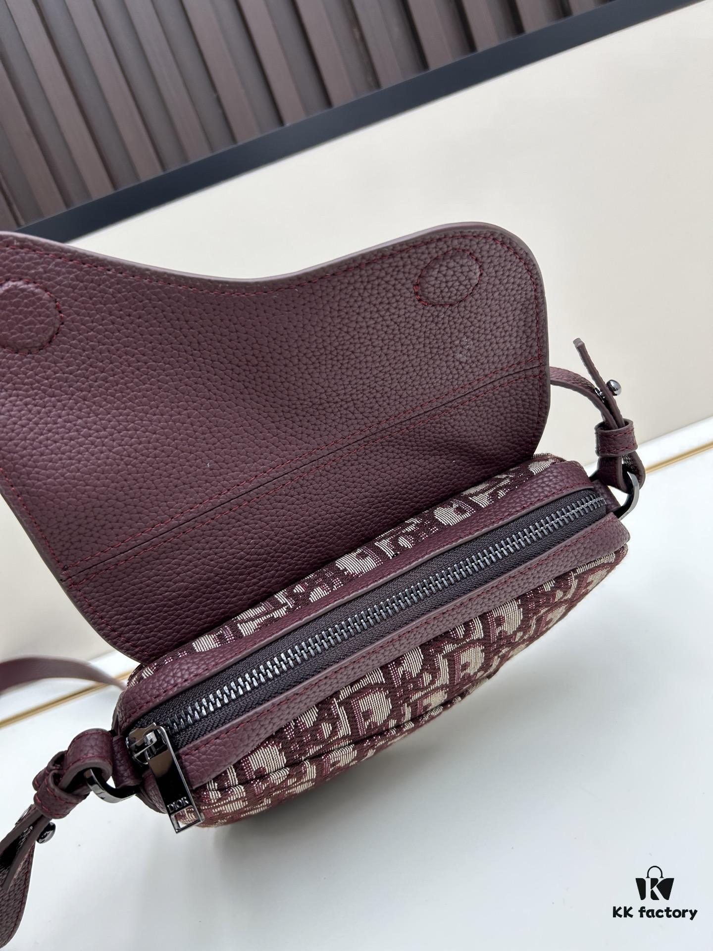 69309d136e68136f4d9ab15f This saddle bag reinterprets the classic design with a modern structure. Crafted from beige and black Oblique printed fabric, it features a signature grained black calfskin magnetic flap and hidden zip closure. The interior includes a spacious compartment and slip pocket for daily essentials. The mini style comes with an adjustable, detachable leather shoulder strap, allowing for handheld, shoulder, or crossbody wear.
